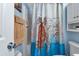 Clean bathroom with shower/tub combo, vanity, and a sea turtle-themed shower curtain at 3310 Loveland Blvd # 1502, Punta Gorda, FL 33980