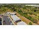 Aerial view of residential buildings near a wooded area at 3310 Loveland Blvd # 1502, Punta Gorda, FL 33980