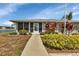 Community building with screened porch and walkway at 3310 Loveland Blvd # 1502, Punta Gorda, FL 33980