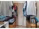 Large walk-in closet with ample shelving and hanging space for clothes at 3310 Loveland Blvd # 1502, Punta Gorda, FL 33980