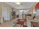 Open living room, featuring a fireplace and access to kitchen at 3310 Loveland Blvd # 1502, Punta Gorda, FL 33980