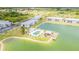 Aerial view of community pool, dock, and surrounding buildings at 3310 Loveland Blvd # 1502, Punta Gorda, FL 33980