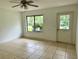 Spacious living room with tile flooring and large window at 1160 Belkton Ave, Port Charlotte, FL 33948