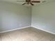 Simple bedroom with tile flooring and ceiling fan at 1160 Belkton Ave, Port Charlotte, FL 33948