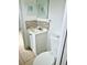 Simple bathroom with white vanity and toilet at 1160 Belkton Ave, Port Charlotte, FL 33948