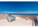 Spacious rooftop deck with bay views and white railings at 1500 Park Beach Cir # 3C, Punta Gorda, FL 33950
