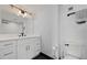 Modern bathroom with white vanity, gold accents, and walk-in shower at 1500 Park Beach Cir # 3C, Punta Gorda, FL 33950