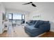 Bright living room with water views, comfortable sectional sofa, and hardwood floors at 1500 Park Beach Cir # 3C, Punta Gorda, FL 33950