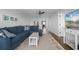 Open living room with sectional sofa and view into the kitchen and dining area at 1500 Park Beach Cir # 3C, Punta Gorda, FL 33950