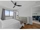 Comfortable bedroom with water views, dresser, and hardwood floors at 1500 Park Beach Cir # 3C, Punta Gorda, FL 33950