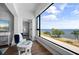 Relaxing sitting area with water view, comfy armchairs, and hardwood floors at 1500 Park Beach Cir # 3C, Punta Gorda, FL 33950