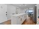 Modern kitchen with island, stainless steel appliances, and white cabinets at 1500 Park Beach Cir # 3C, Punta Gorda, FL 33950