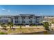 Waterfront condo building with parking and lush landscaping at 1500 Park Beach Cir # 3C, Punta Gorda, FL 33950