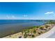 Stunning view of the bay, shoreline, and palm trees at 1500 Park Beach Cir # 3C, Punta Gorda, FL 33950