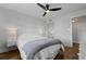 Spacious bedroom with ceiling fan, wood floors and mirrored closet at 1500 Park Beach Cir # 3C, Punta Gorda, FL 33950