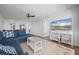 L-shaped sectional sofa in living room with view into the kitchen and dining area at 1500 Park Beach Cir # 3C, Punta Gorda, FL 33950