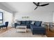 Spacious living area featuring a sectional sofa and a view into the dining area at 1500 Park Beach Cir # 3C, Punta Gorda, FL 33950