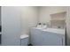 Laundry area with full-size washer and dryer, plus shelving at 1500 Park Beach Cir # 3C, Punta Gorda, FL 33950