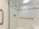 Walk-in shower with marble tile and grab bars at 1750 Jamaica Way # 113, Punta Gorda, FL 33950