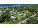 This home is complimented by its large yard, an outbuilding, and landscaping, as seen from above at 27437 Dutch Ave, Punta Gorda, FL 33982