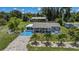 Beautiful home with an outbuilding and charming landscaping, captured in this stunning aerial perspective at 27437 Dutch Ave, Punta Gorda, FL 33982