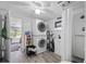 Functional bathroom with stacked washer and dryer units and walk-in shower at 27437 Dutch Ave, Punta Gorda, FL 33982