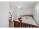 Simple bedroom with hardwood floors, a comfortable bed, and a window for natural light at 27437 Dutch Ave, Punta Gorda, FL 33982