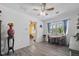 Cozy dining area with wood-look flooring, natural light from the windows, and adjacent kitchen access at 27437 Dutch Ave, Punta Gorda, FL 33982