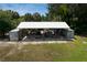 Large detached garage with ample storage space for vehicles, boats, and equipment at 27437 Dutch Ave, Punta Gorda, FL 33982