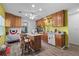 Traditional kitchen features wood cabinetry, an island with seating, and modern appliances at 27437 Dutch Ave, Punta Gorda, FL 33982