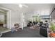 Bright living area with comfortable seating, multiple ceiling fans, and access to additional rooms at 27437 Dutch Ave, Punta Gorda, FL 33982