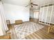Spacious living room with wood-look floors and a large window at 22239 Midway Blvd, Port Charlotte, FL 33952