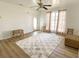 Living room with wood-look floors and plenty of natural light at 22239 Midway Blvd, Port Charlotte, FL 33952