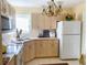 Bright kitchen features ample cabinetry, modern appliances, and a double sink at 22239 Midway Blvd, Port Charlotte, FL 33952