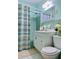 Clean bathroom with a bathtub, shower, and updated vanity at 22239 Midway Blvd, Port Charlotte, FL 33952