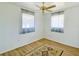 Spacious bedroom with wood-look floors and ample natural light at 22239 Midway Blvd, Port Charlotte, FL 33952