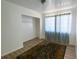 Bright bedroom with wood-look floors and a large closet at 22239 Midway Blvd, Port Charlotte, FL 33952
