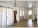 Bright living room featuring hardwood floors and updated light fixtures at 22239 Midway Blvd, Port Charlotte, FL 33952