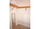 Walk-in closet with built-in shelving, mirror, and shoe storage at 87 Vivante Blvd # 8742, Punta Gorda, FL 33950