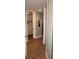 Hallway with light walls, wood flooring, and access to closet at 87 Vivante Blvd # 8742, Punta Gorda, FL 33950