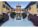 Elegant courtyard with two staircases and a central fountain at 87 Vivante Blvd # 8742, Punta Gorda, FL 33950