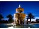 Ornate fountain at night with lights illuminating the water feature at 87 Vivante Blvd # 8742, Punta Gorda, FL 33950
