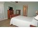 Main bedroom with wood floors and large sliding doors to balcony at 87 Vivante Blvd # 8742, Punta Gorda, FL 33950