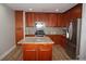 Island kitchen with granite countertops and stainless steel appliances at 87 Vivante Blvd # 8742, Punta Gorda, FL 33950