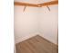 Walk-in closet with wooden shelving and wire shoe racks at 87 Vivante Blvd # 8742, Punta Gorda, FL 33950