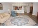 Open living room with kitchen views and hardwood floors at 87 Vivante Blvd # 8742, Punta Gorda, FL 33950