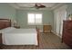 Spacious bedroom with wood flooring, large windows, and ceiling fan at 87 Vivante Blvd # 8742, Punta Gorda, FL 33950
