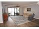 Bright living room with access to a balcony and hardwood floors at 87 Vivante Blvd # 8742, Punta Gorda, FL 33950