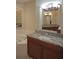 Bathroom vanity with granite countertop and wood cabinets at 87 Vivante Blvd # 8742, Punta Gorda, FL 33950