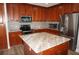 Spacious kitchen with island and wood cabinets at 87 Vivante Blvd # 8742, Punta Gorda, FL 33950